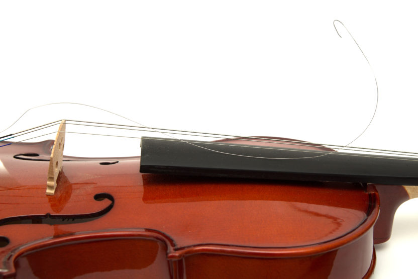 a violin with one broken string
